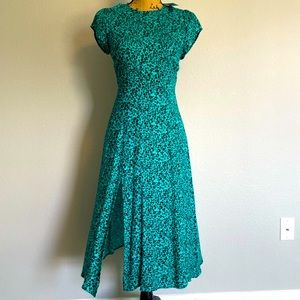 Turquoise leopard midi dress with cap sleeve and slit up knee.Size small